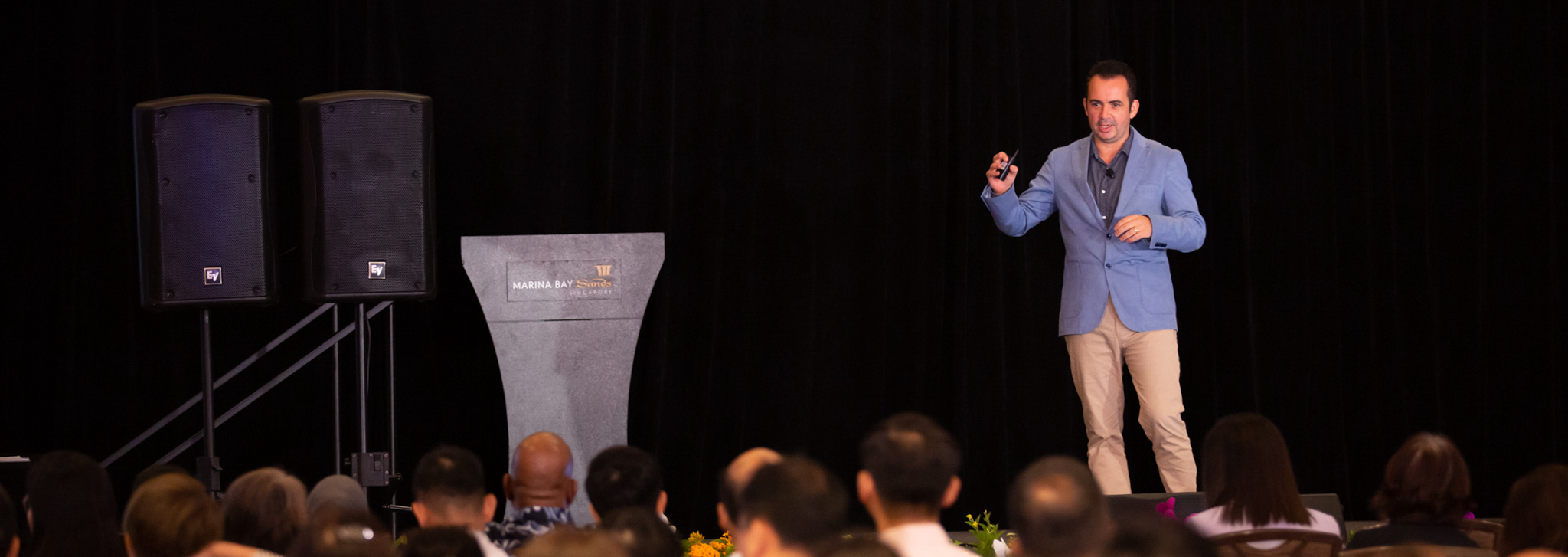 Marc Mekki delivering a keynote at Marina Bay Sands, Singapore