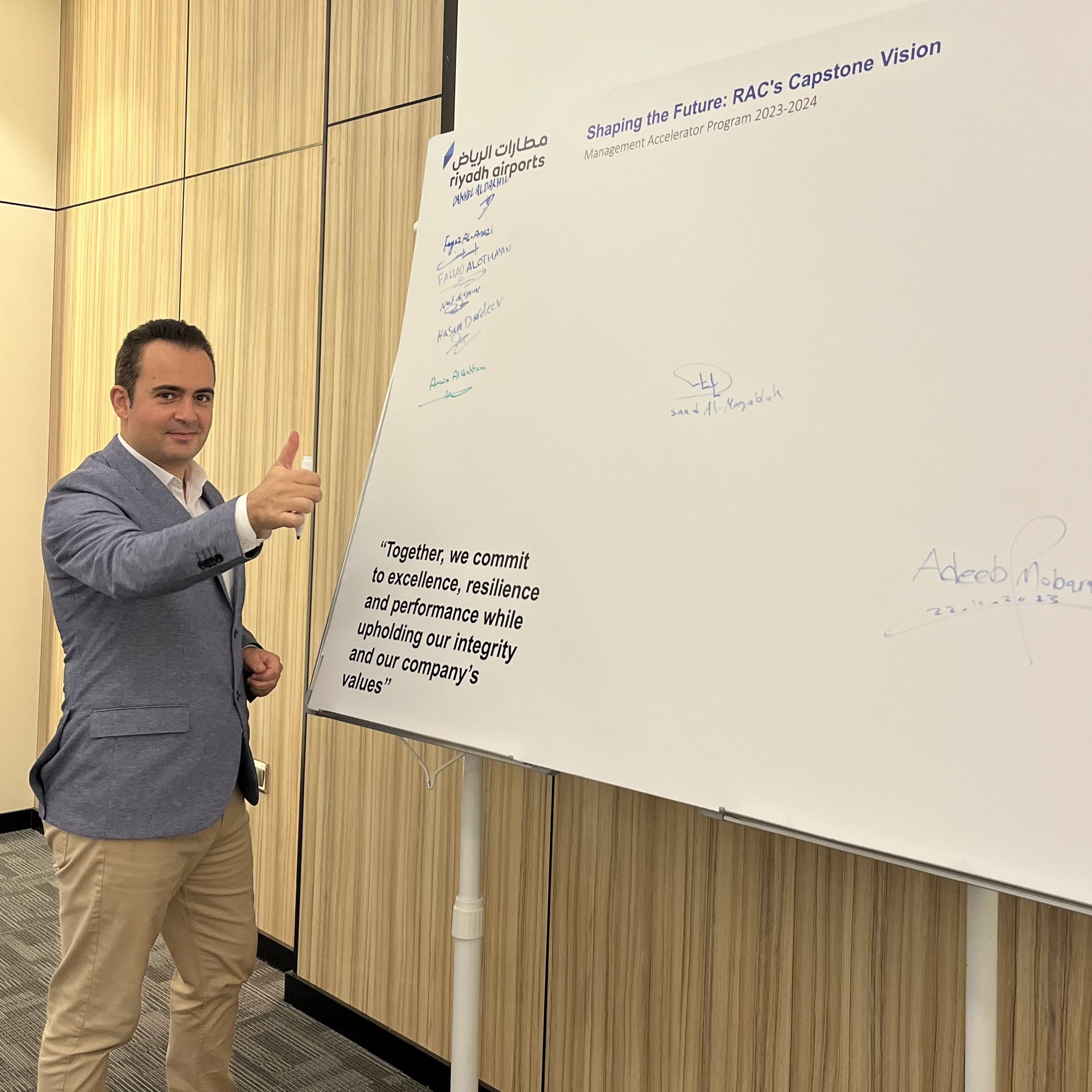 Marc Mekki at a Riyadh Airports leadership program signing session
